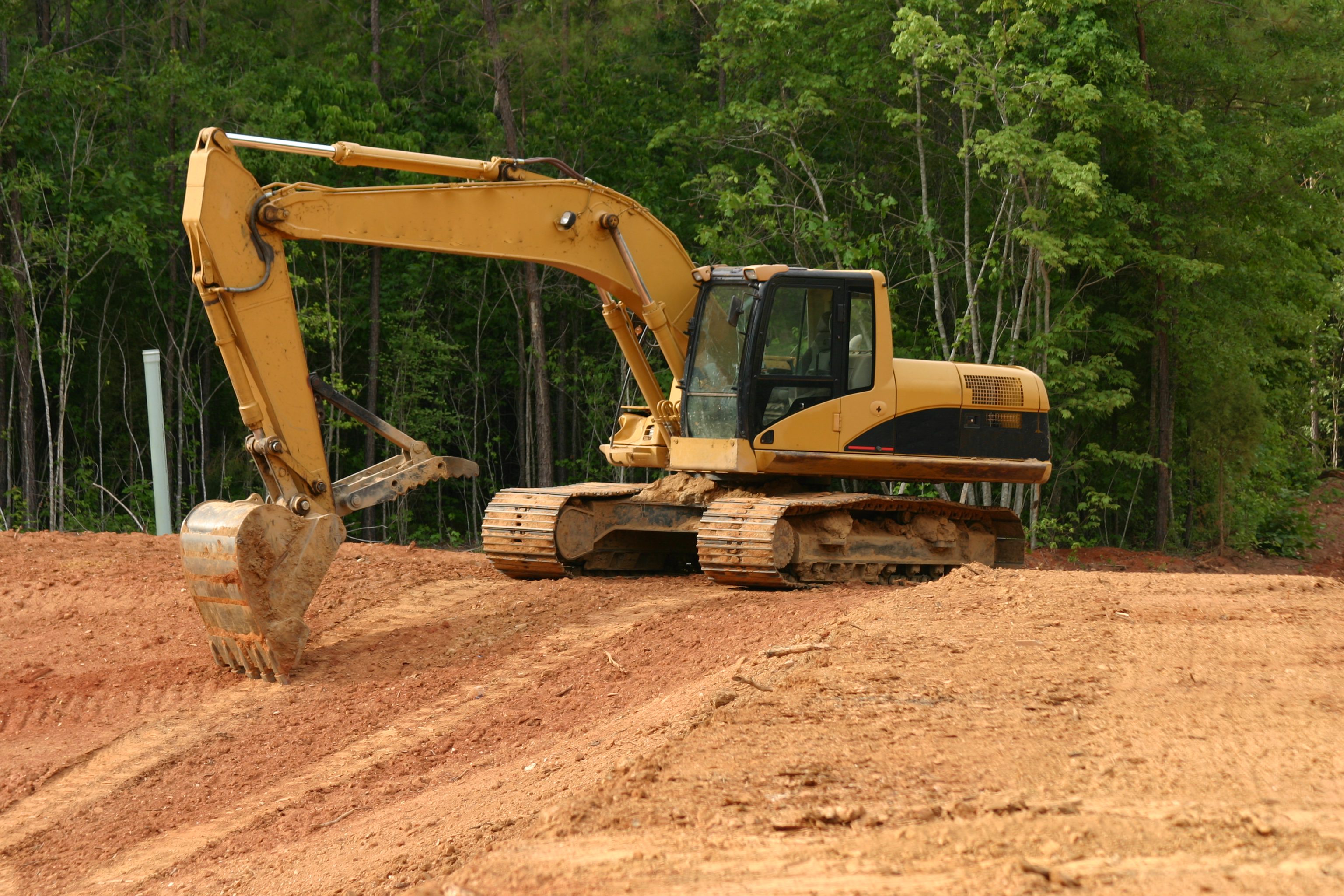 Excavator on a dirt construction site.