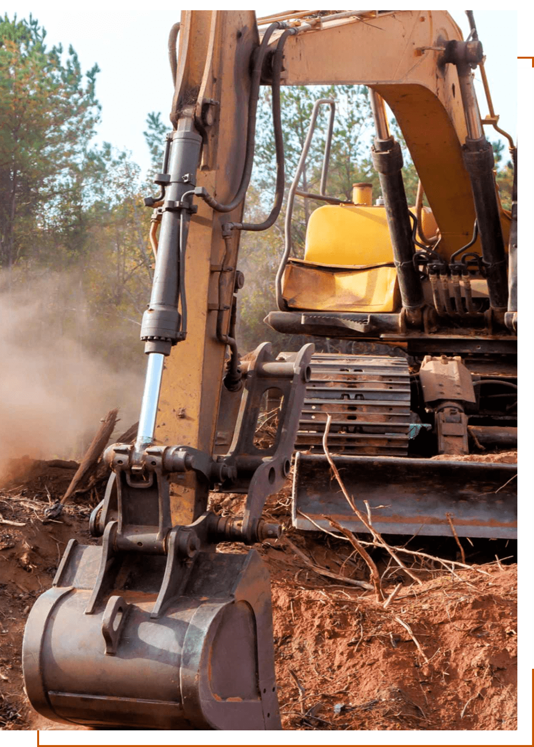 Excavator digging soil at construction site.